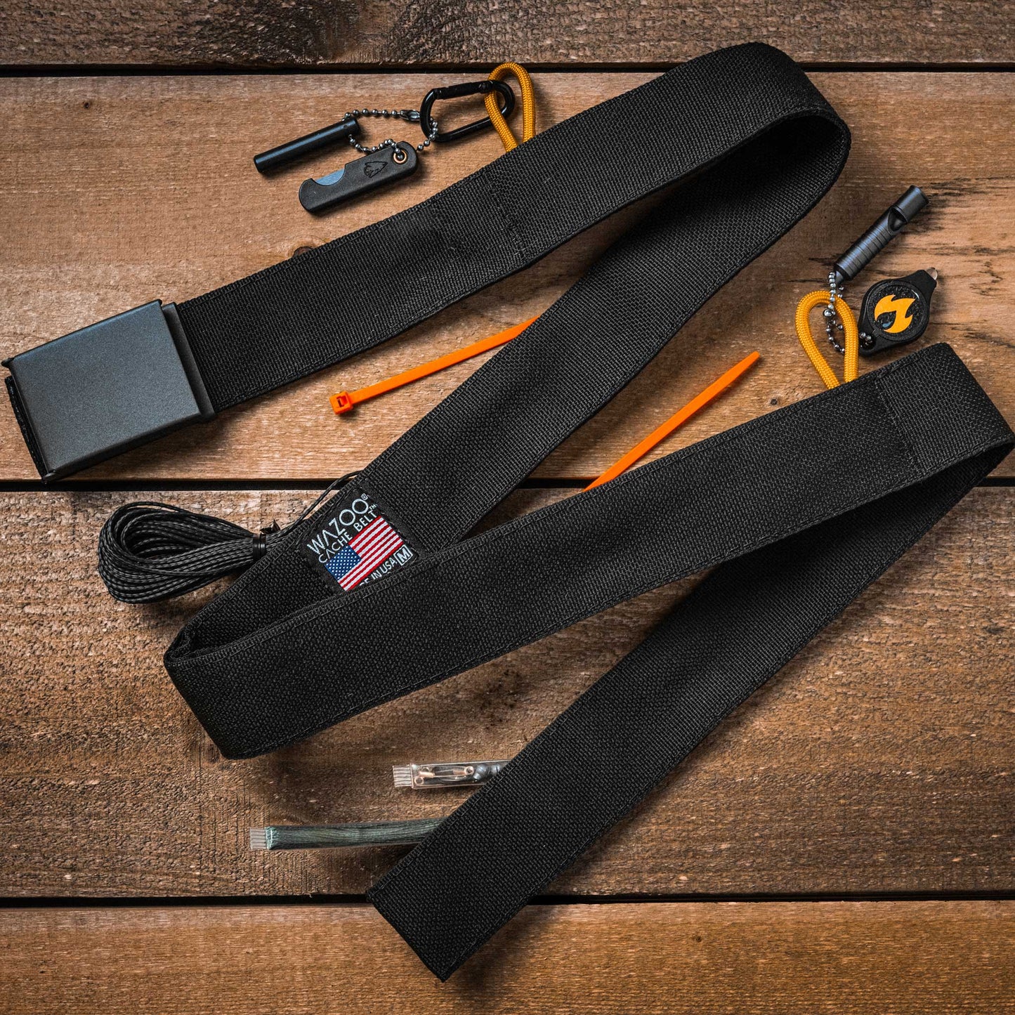Black belt with tools on a wooden surface