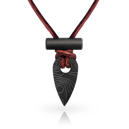 Black arrowhead pendant on a red cord against a white background