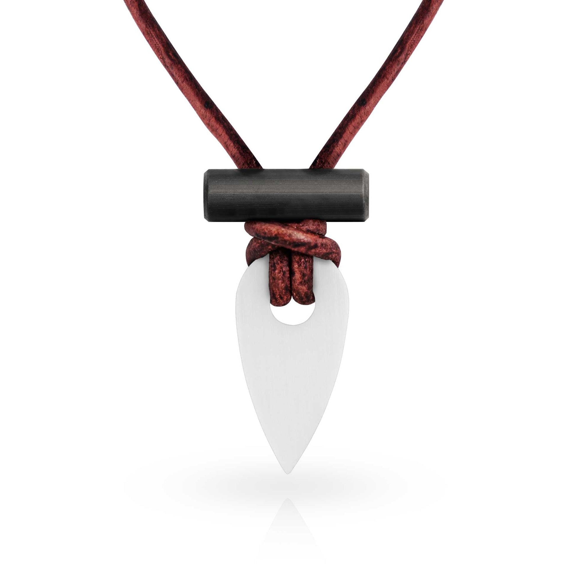 Necklace with a white pendant and black accent on a red cord against a white background